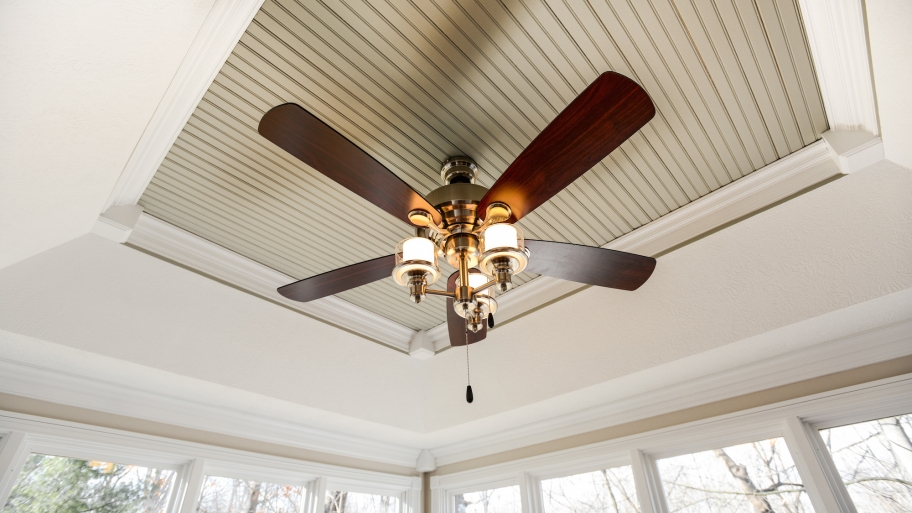ceiling fan with wood blades and glass globe lights