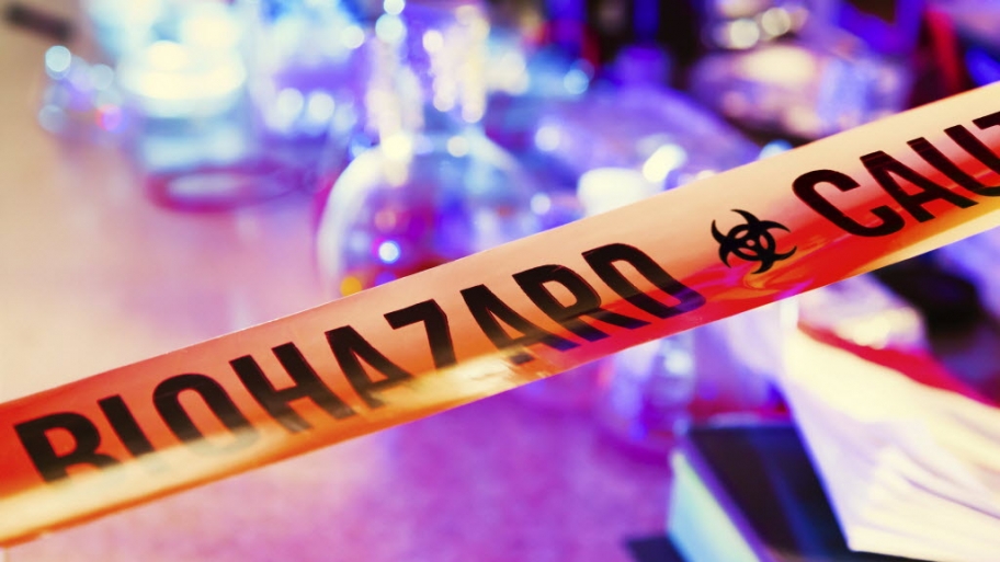An orange tape with the word biohazard printed in black.