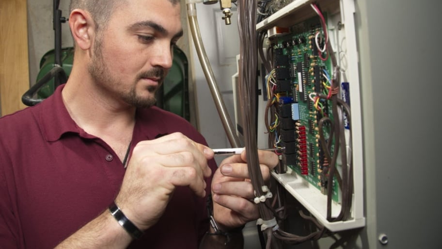 technician installing dehumidifier