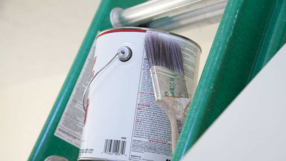 Can of paint on a ladder