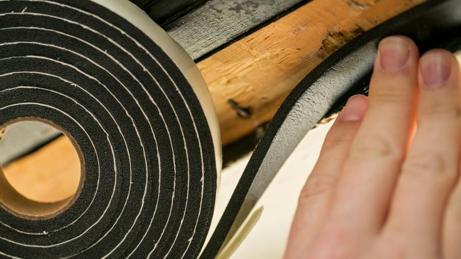 foam weather stripping being installed