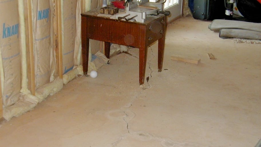 Unfinished basement with cracks