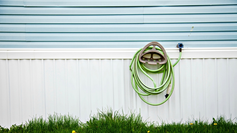 garden hose hanging on wall