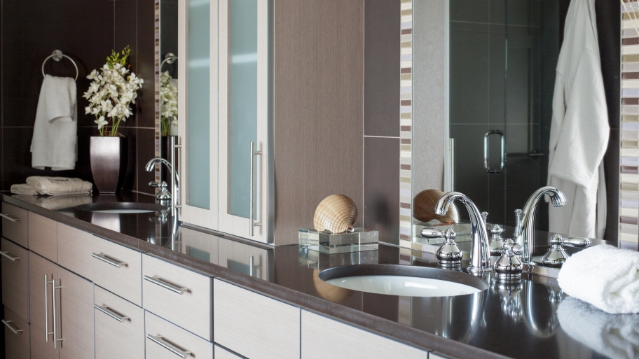 gray bathroom sink vanity with mirrors
