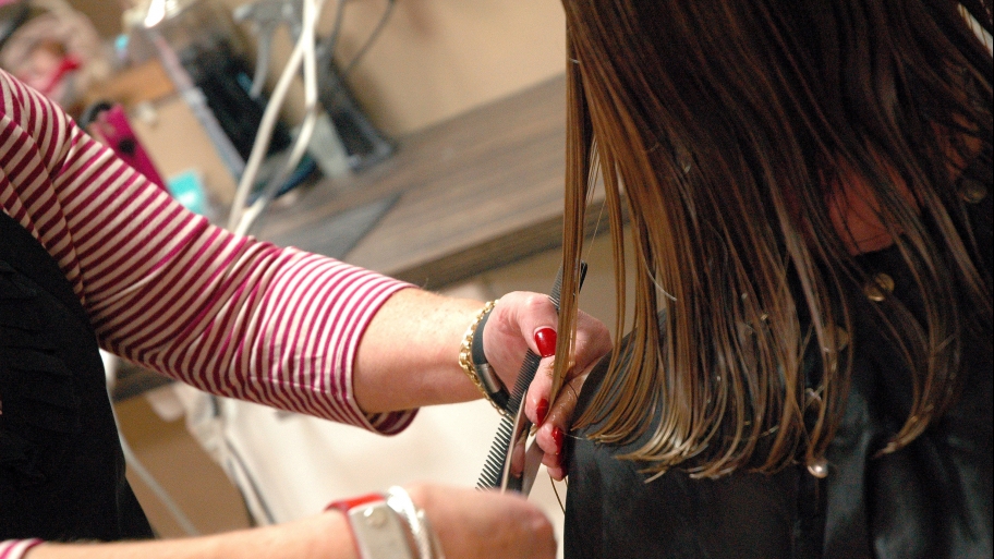 hairstylist cutting hair