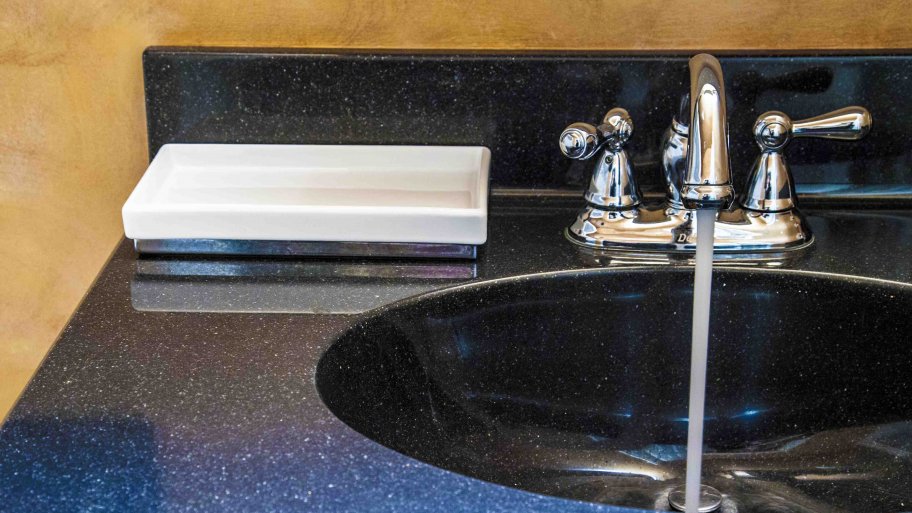 hard water running from faucet