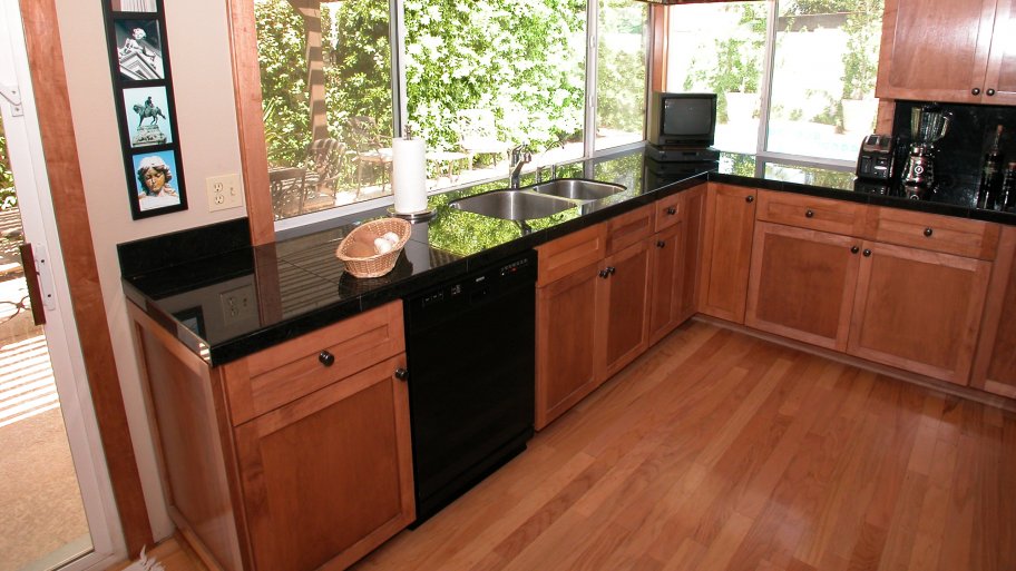 cherry hardwood floors and cabinets in kitchen