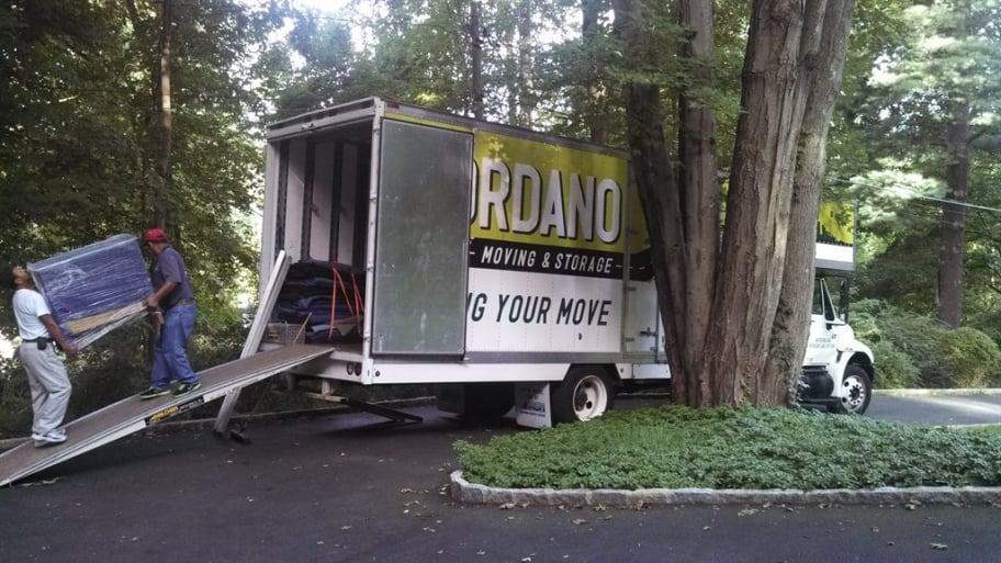 Movers load a moving truck