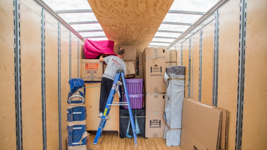 Moving crews loading a moving truck