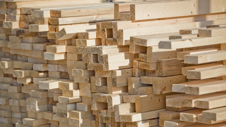 lumber stacked for home construction