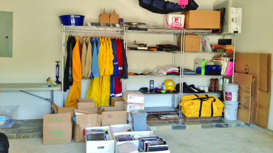 Shelves and boxes of neatly organized items in garage.