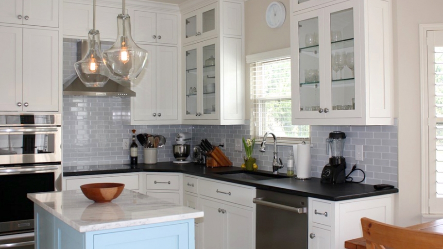Complete kitchen remodel with light fixture and tile backsplash