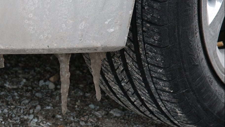 car tire on salt-covered road