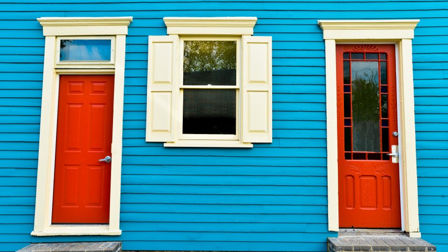 red doors on blue house