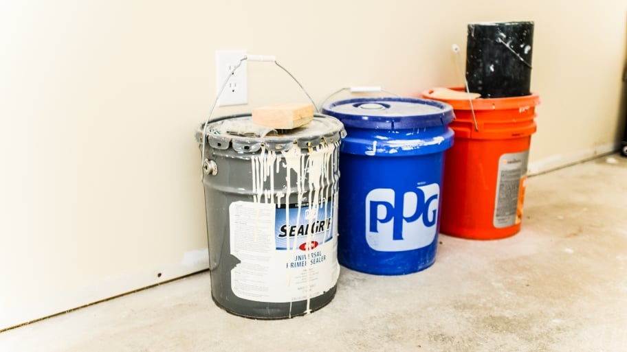 buckets of paint and sealers