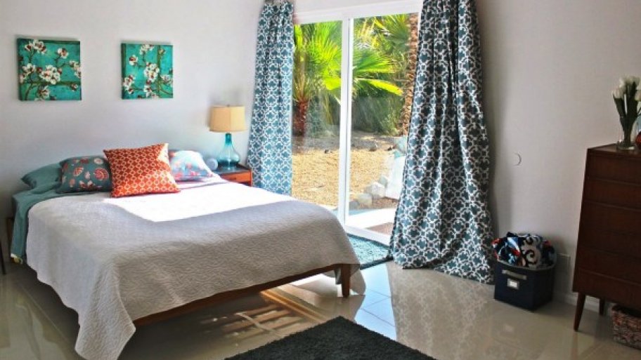 organized bedroom with window view