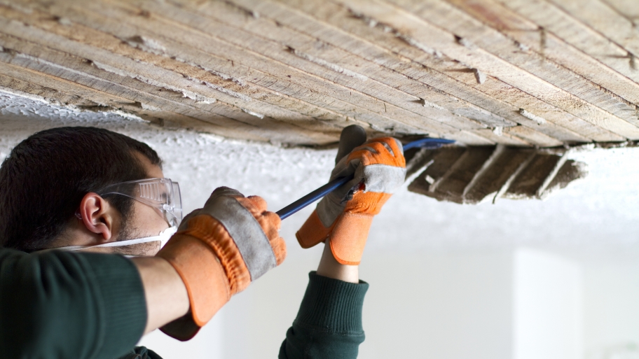 guy repairing plaster ceiling