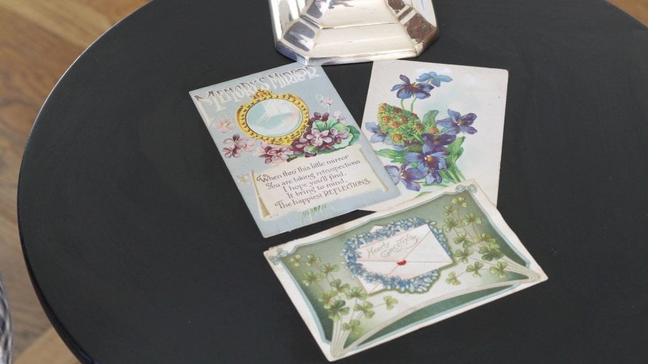 vintage postcards decoupaged on side table