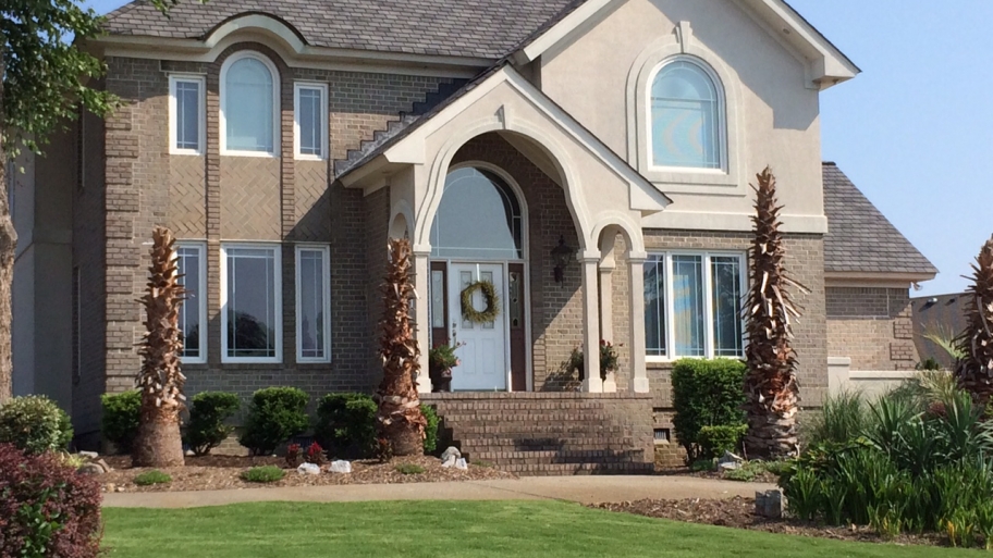 replacement windows two story brick stucco house