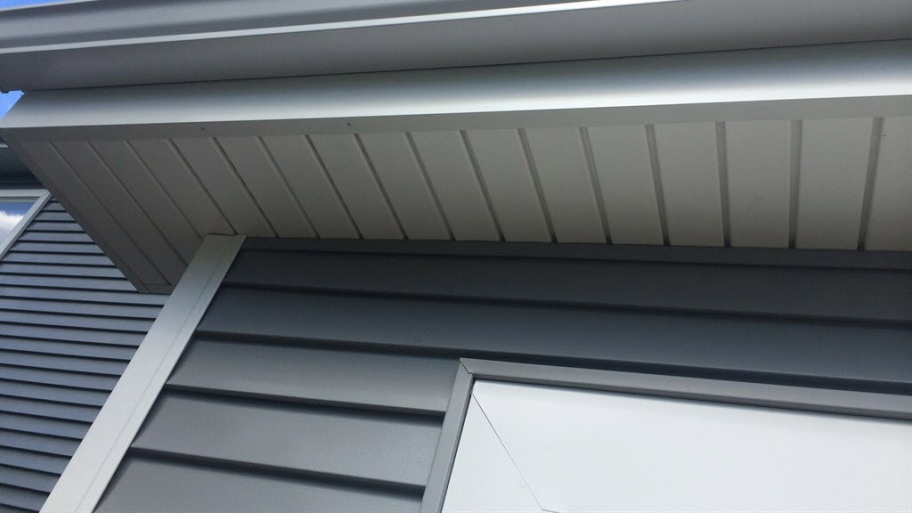 a house with grey siding and white trim