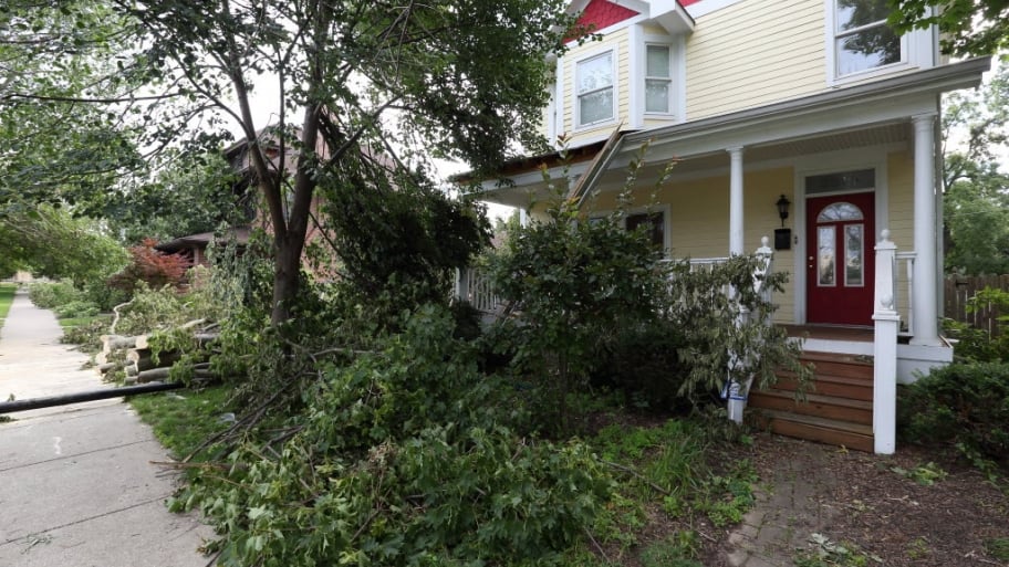 a house with a tree down in front