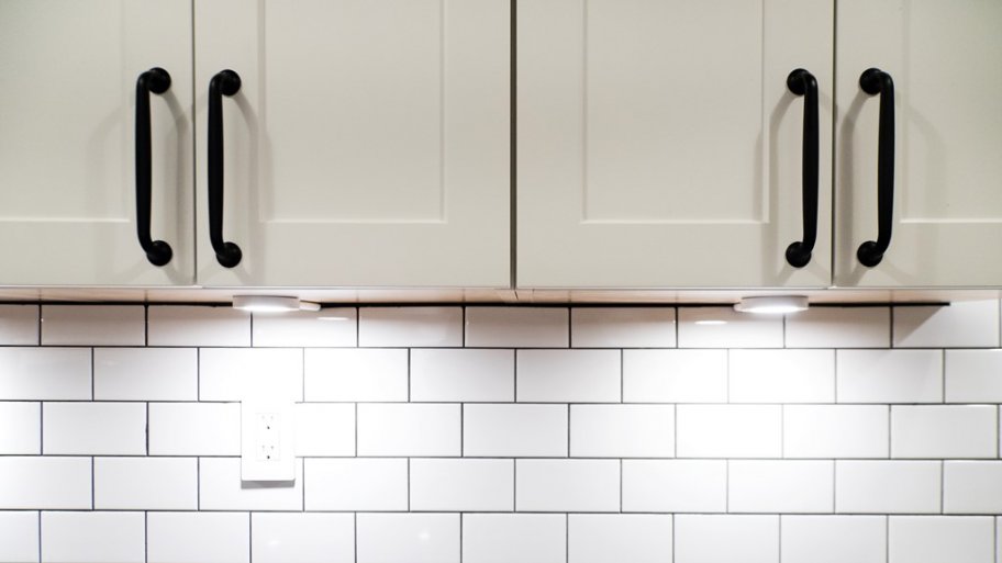 White kitchen cabinets with lighting