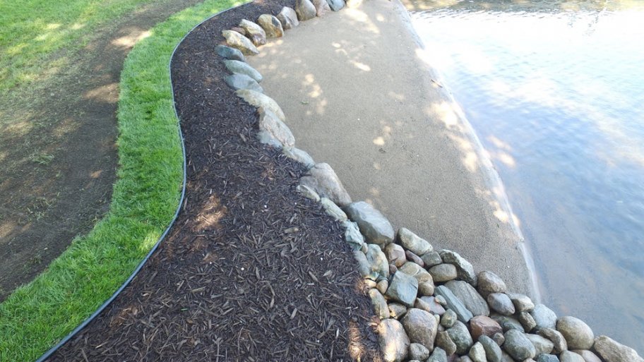 A lakeshore with landscaping.