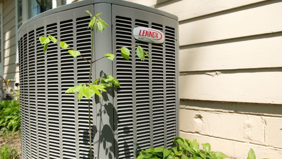 Lennox heat pump unit on side of house