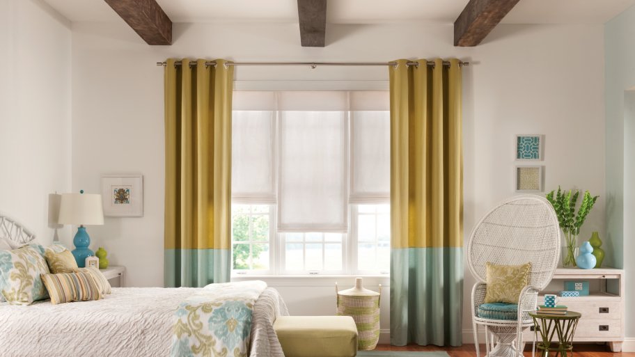 bedroom drapery with roller shades
