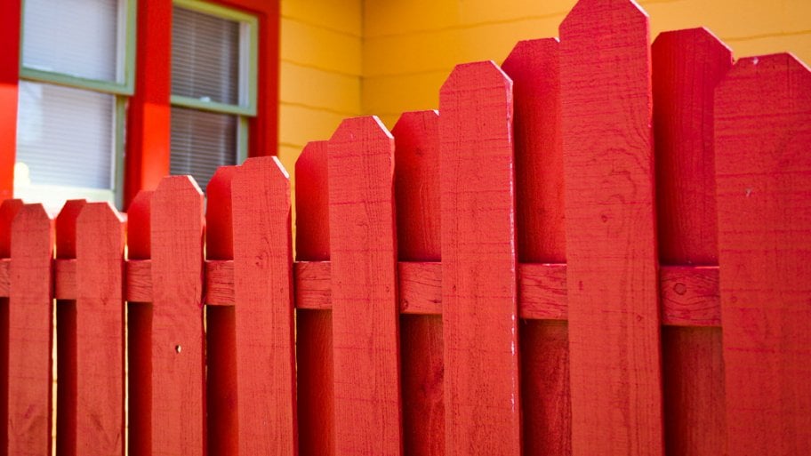 red painted wood fence
