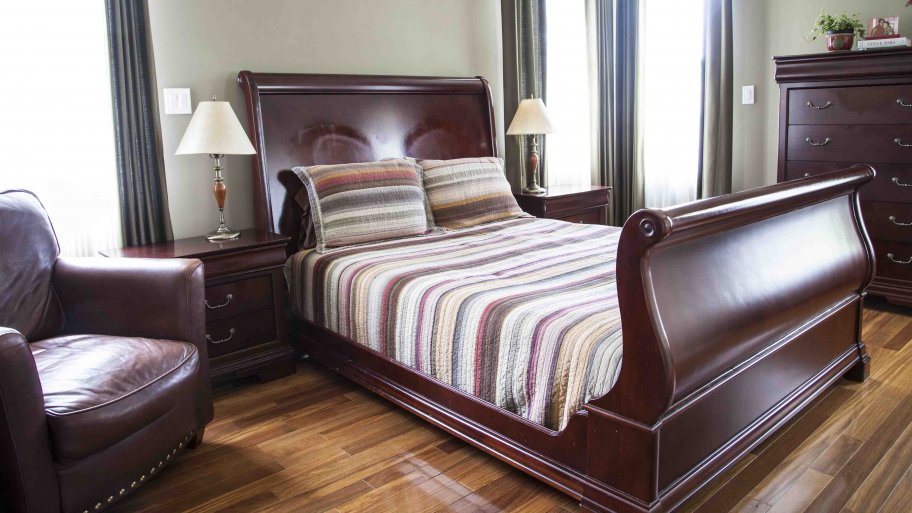 master bedroom with leather armchair