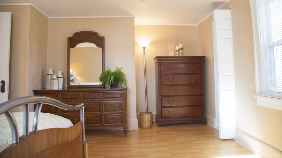 master bedroom with wood floors