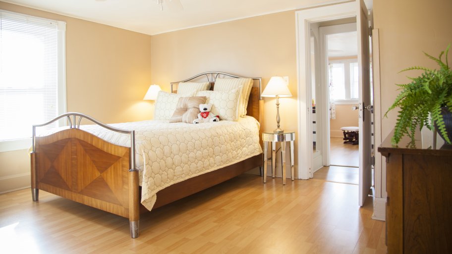 master bedroom with hardwood floors