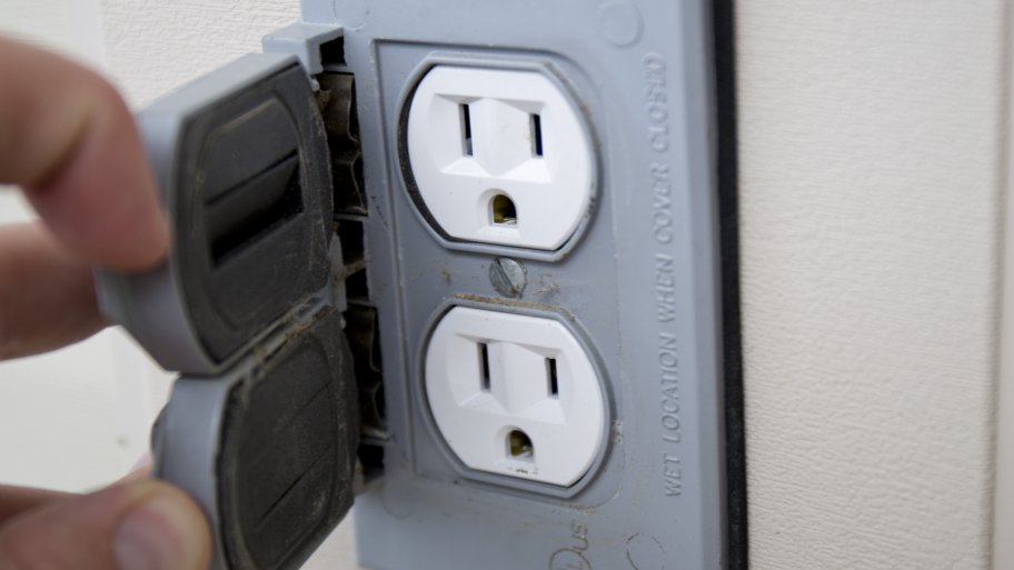outdoor electrical outlet held open