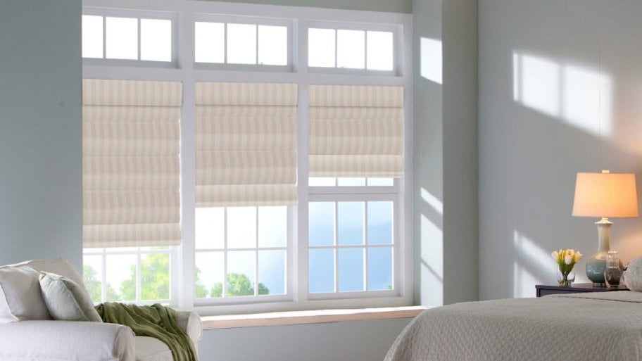 windows with striped Roman shades