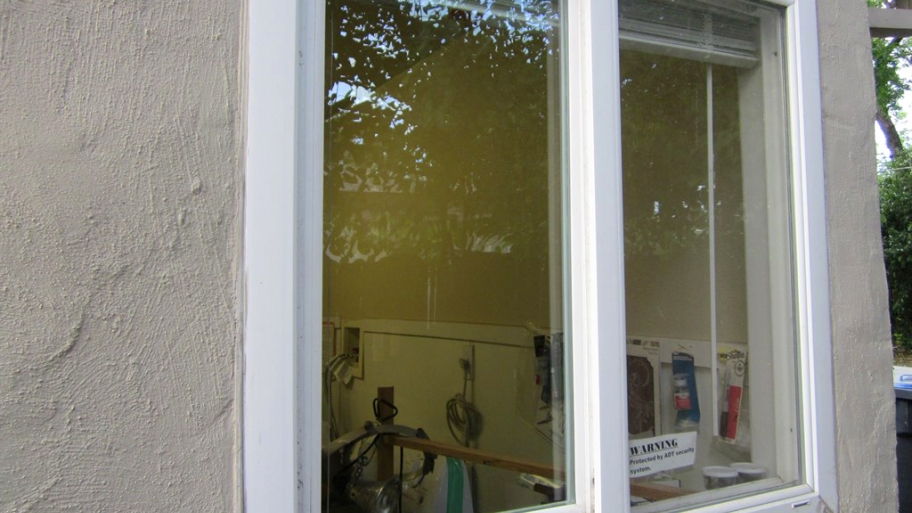 glass in window frame on house