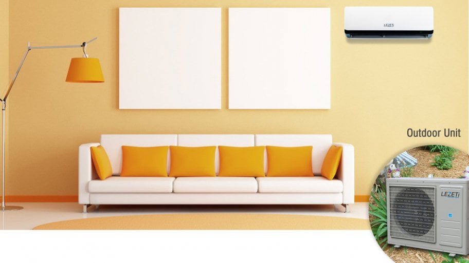 A Lezeti solar air conditioner in a room with white couch and orange pillows and lamp shade