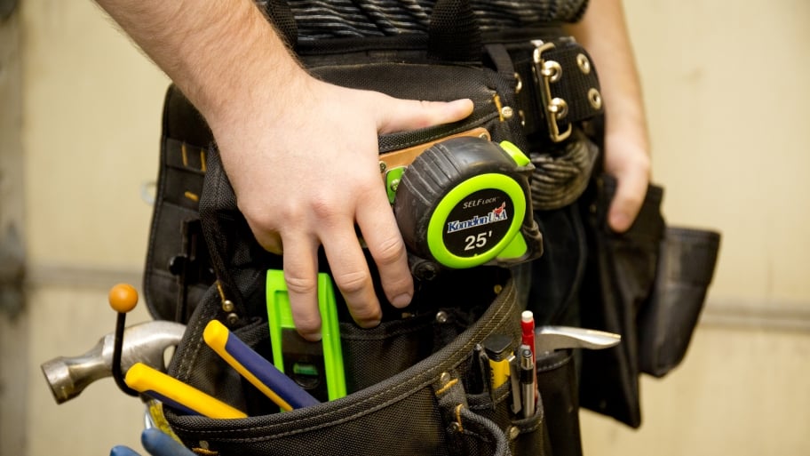 guy with toolbelt full of tools
