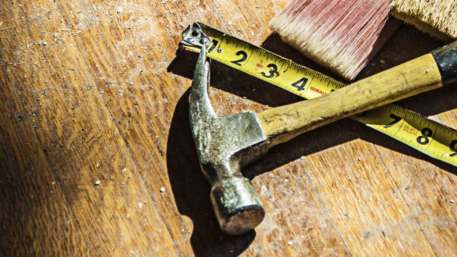 hanmmer, paintbrush and tape measure