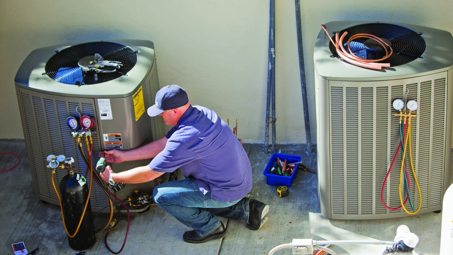HVAC contractor installs air conditioner