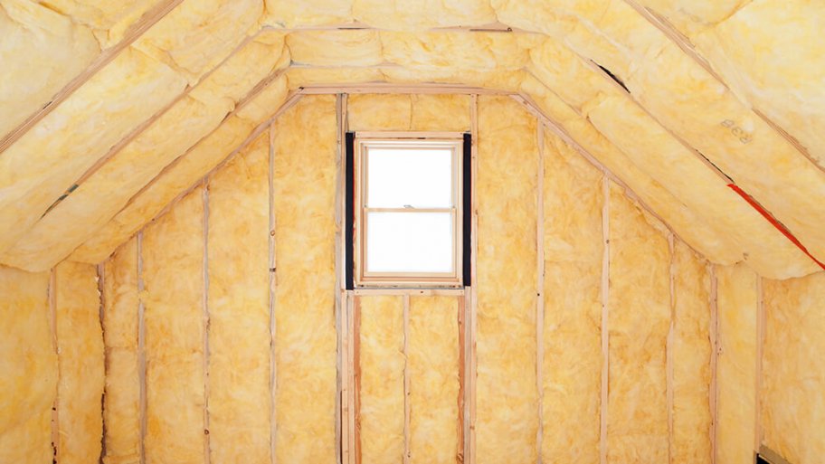 Insulated attic with sunshine coming in through the window Insulated attic with sunshine coming in through the window