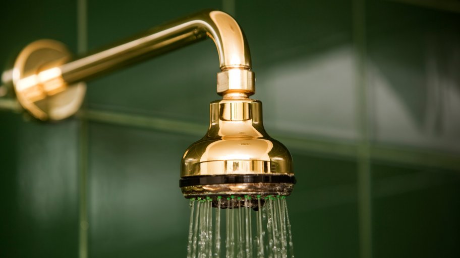 A shower head running water