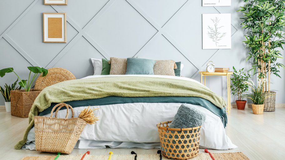 Blue geometric accent wall in bedroom