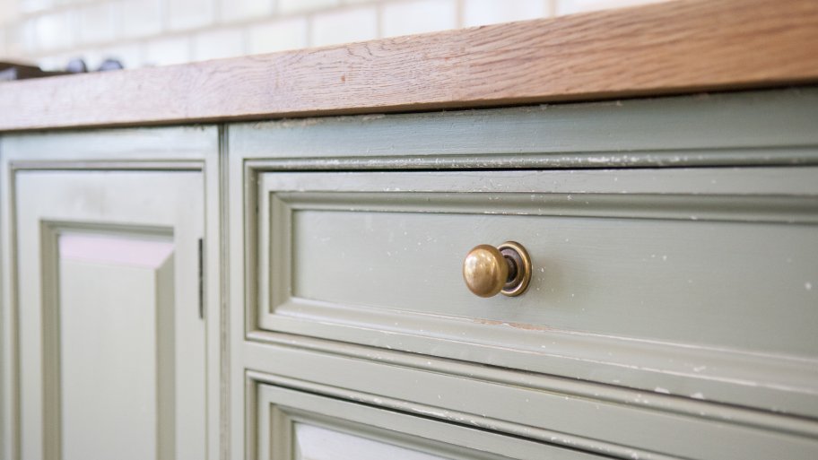 old green drawer and cabinets