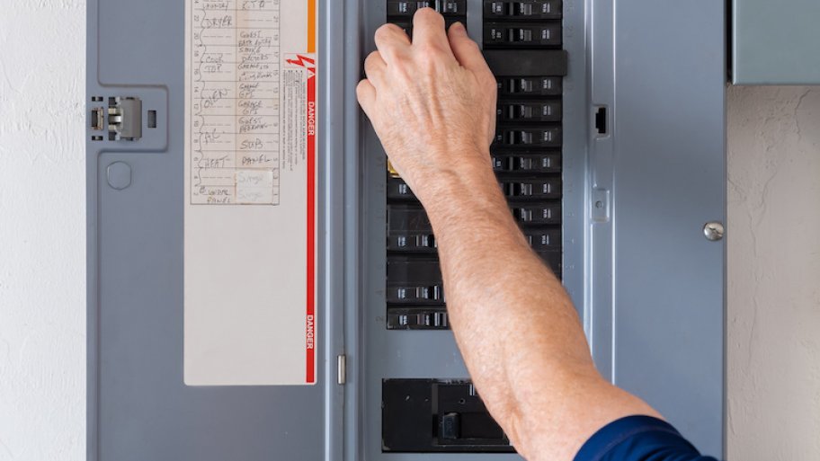 hand adjusting circuit breaker in home