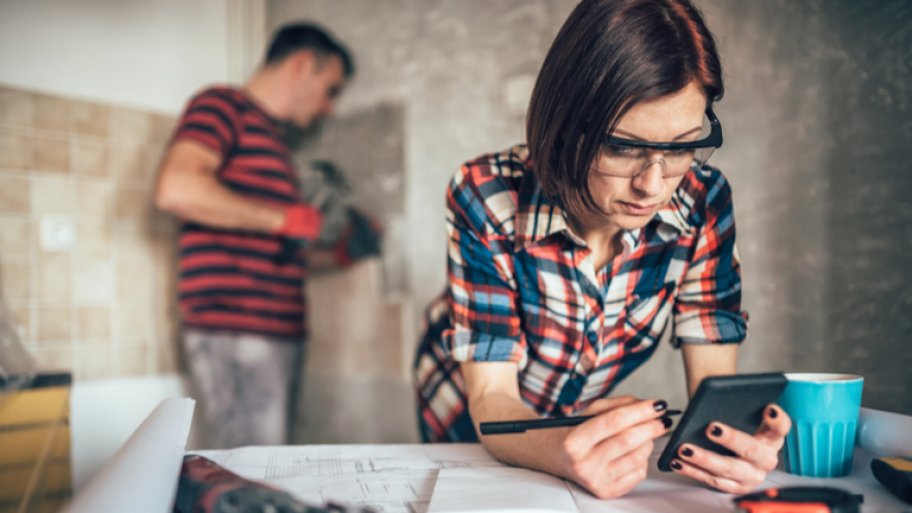 Female construction manager one smartphone
