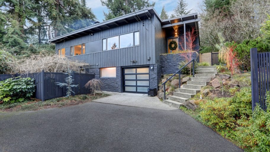 Asphalt driveway leading up to a two-story contemporary home