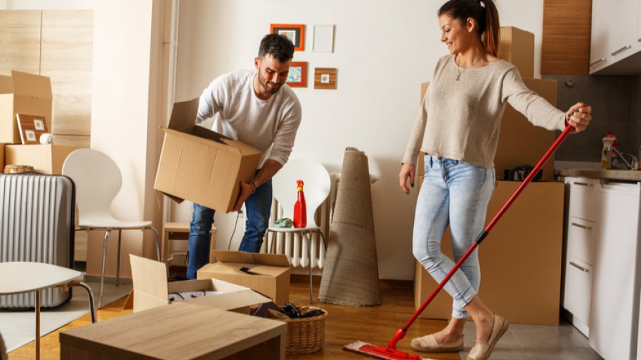 Couple cleaning house before a move