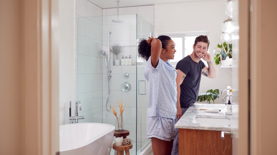 Couple gets ready in bathroom (Photo by Monkey Business - stock.adobe.com)