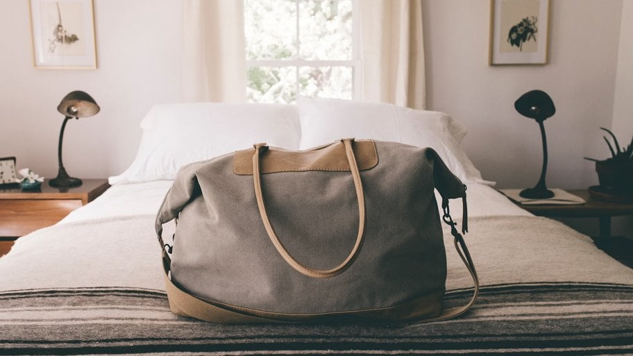 Duffle bag on bed
